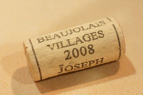 wine bottle cap with Beaujolais villages 2008 written on it